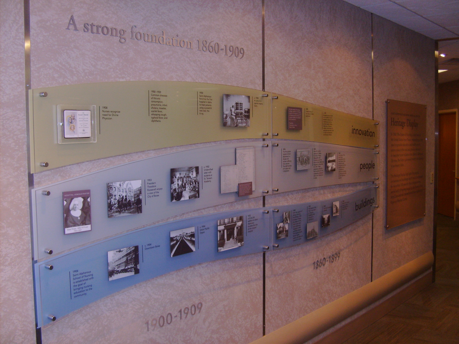 My team and I built a visual time line in the new wing at the Saint Alphonsus Hospital in Boise. There are four more sections of this not seen in the photo. it is made up of lexan acrylic sheets stood off from the wall and applied pictures, artifacts, and text.